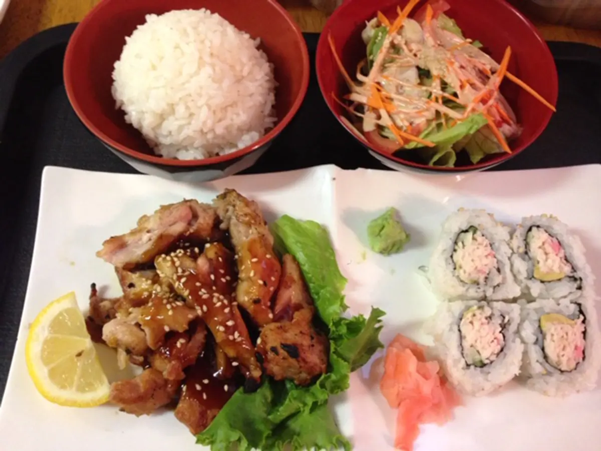 Kitchen-Aloha-Japanese-restaurant-Chicken-Teriyaki-Sushi-Set-San-Francisco Set meal with teriyaki chicken, sushi rolls, salad, rice, pickled ginger, and lemon at Kitchen Aloha Japanese restaurant in San Francisco